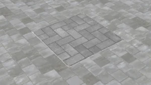 Modern kentsel alanlar ve peyzaj projeleri için peyzaj entegreli, taş dolgulu gizli metal müdahale kapağı uygulaması